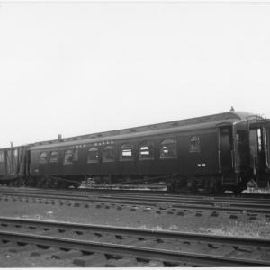 Work Train Dining Car W-153, Formerly Dining Car #2312, In tool train. Side View. Work Service Boxcars, with white script heralds and windows Cut into their doors, visible to the left of the diner. Entire tool train looks freshly painted.