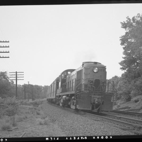 DERS-2c #553 with passenger train, westbound  on Highland Line, near Waterbury