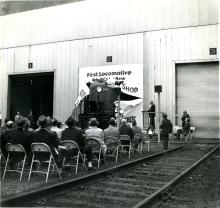 RS-3 #542 1st rebuilt loco at Lamberton Street diesel shop - loco ripping through banner at ceremony held at the south end of the new car shop.