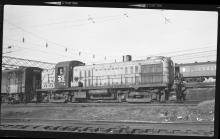 RS-3  #529  leading an FA unit under wire.  An MU car passes on a track behind the diesels