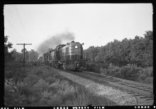 A trio of RS-3s lead by #524 heading a freight train on single track line