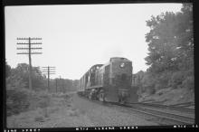 DERS-2c #553 with passenger train, westbound  on Highland Line, near Waterbury