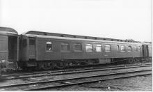 Wooden diner with steel ends and truss rods.